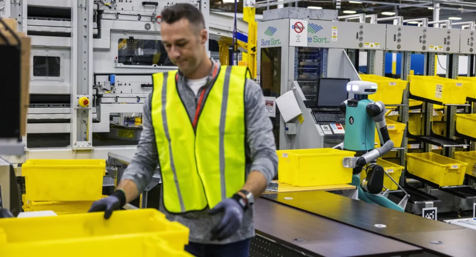 As Amazon's robot ranks swell, workers worry about their future