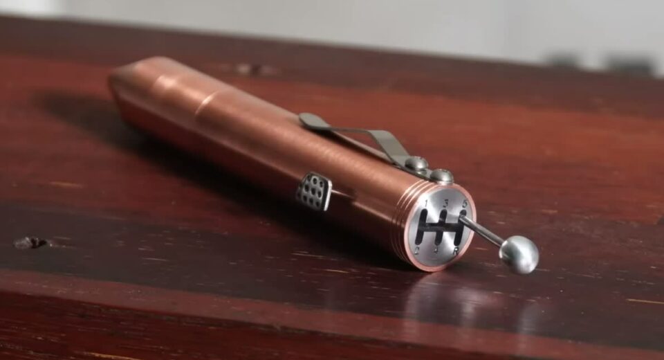 This precision crafted manual transmission pen features a functional clutch