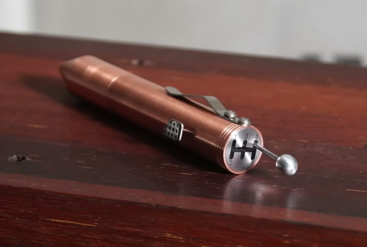 This precision crafted manual transmission pen features a functional clutch