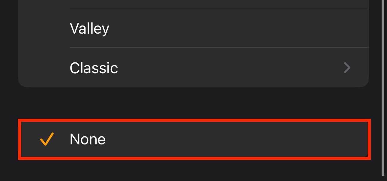 Setting alarm sound in the Watch app on an iPhone to None.