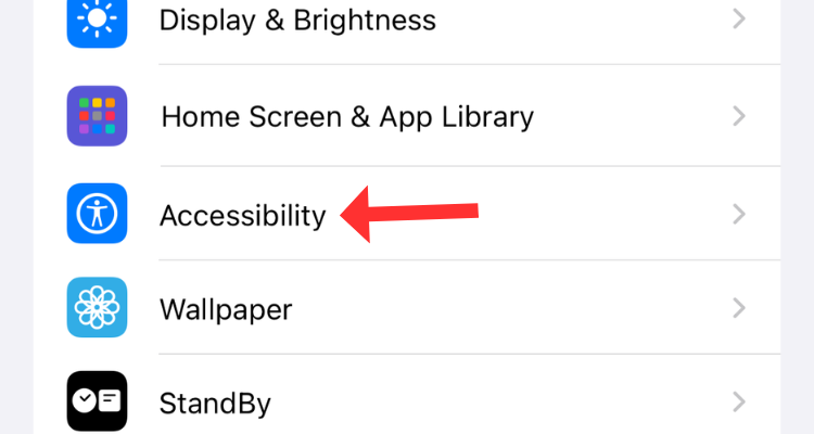 Screenshot of the Settings app with an arrow next to the Accessibility option.