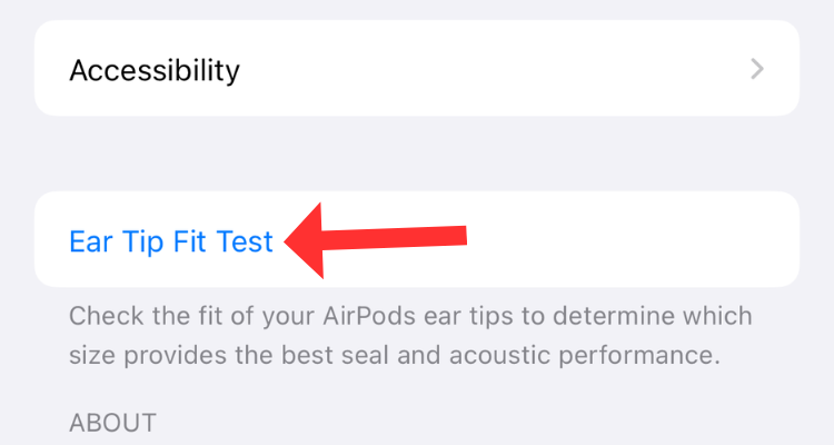 Screenshot of the AirPods settings menu with an arrow next to the Ear Tip Fit Test option.