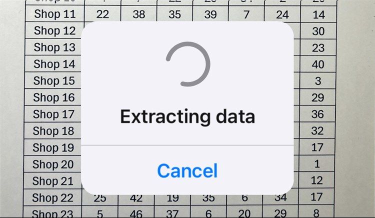 The Excel app with a message on the screen reading 'Extracting Data.'