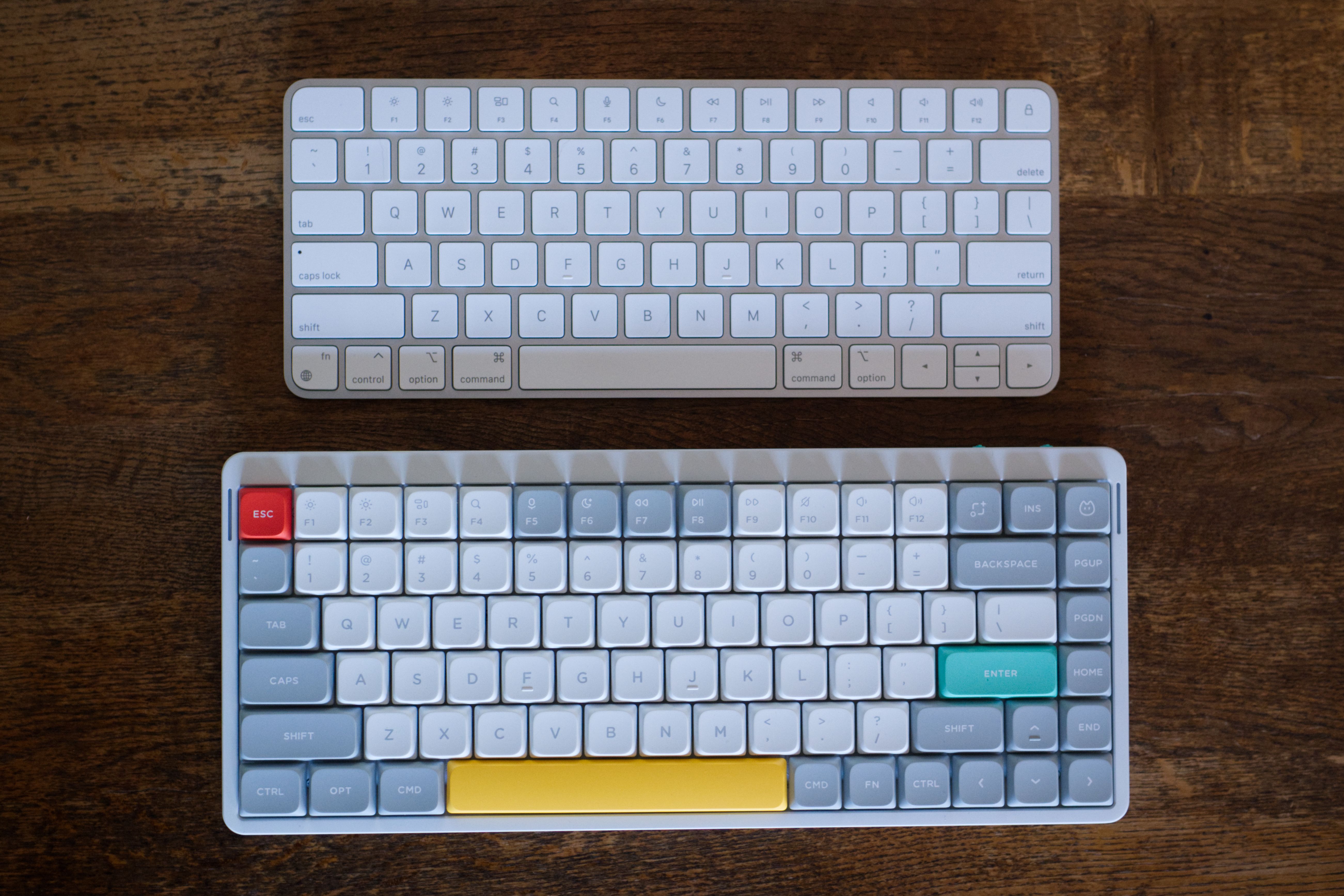 NuPhy Air75 V2 and Apple Magic Keyboard alongside each other.