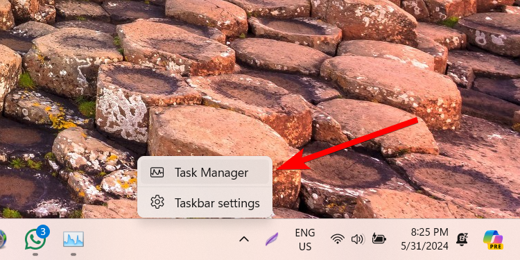 Opening Task Manager using the Taskbar menu.