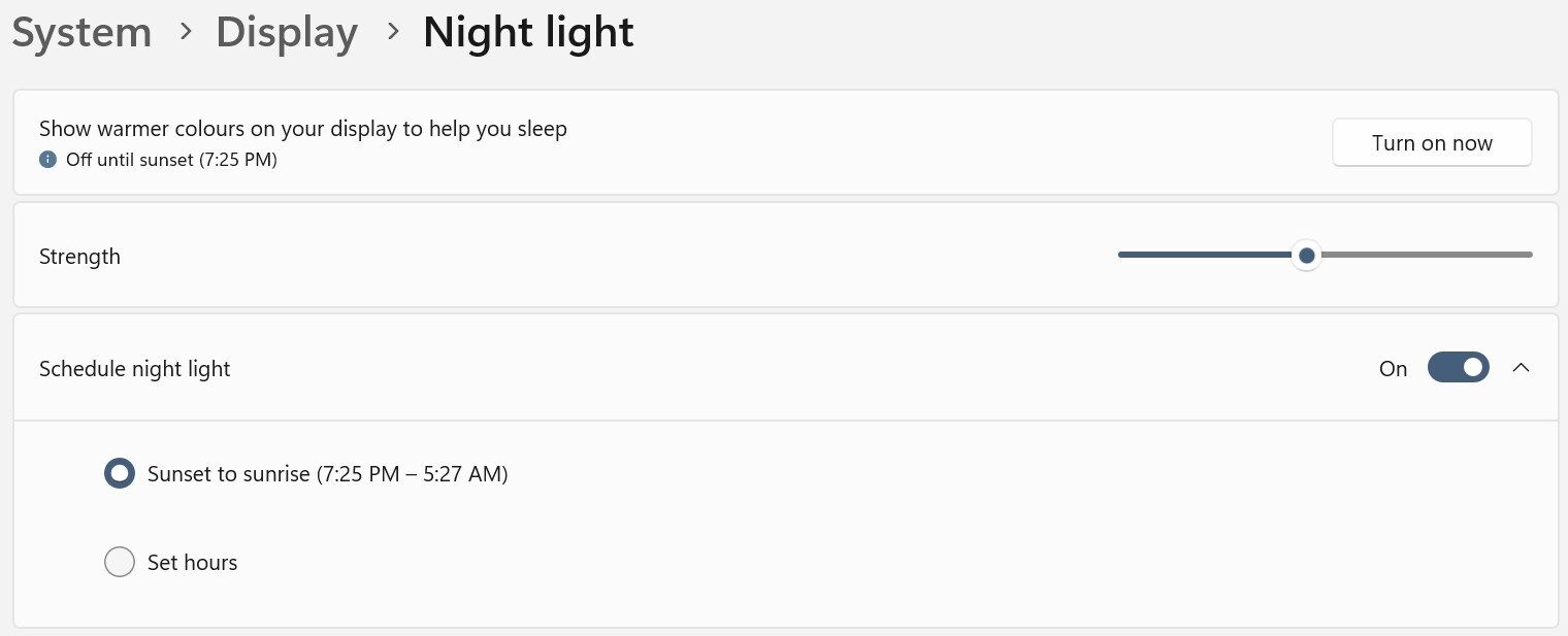 Changing the night light feature settings in the Windows Settings app.