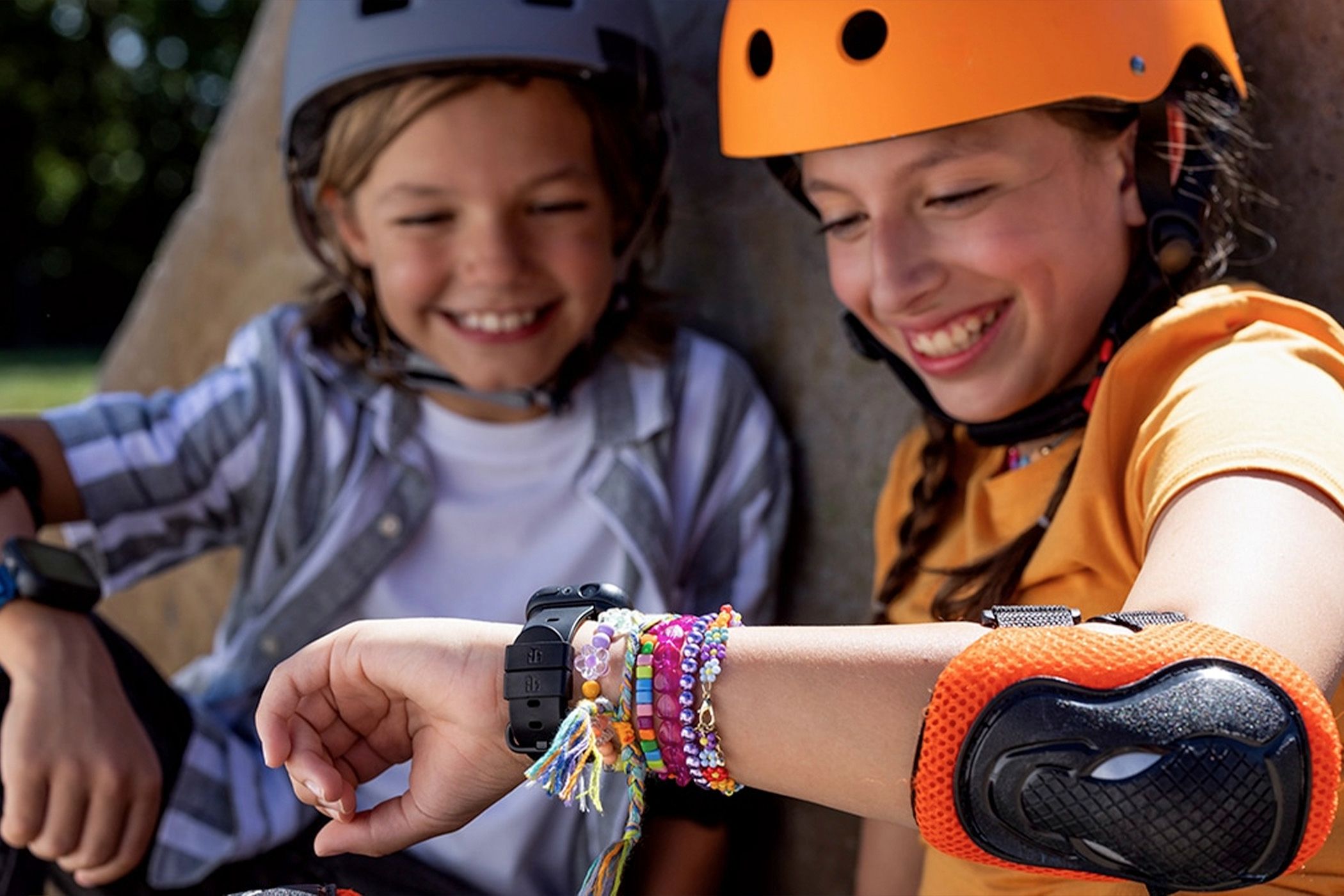 Two kids using the T-Mobile SyncUP Kids Watch 2.