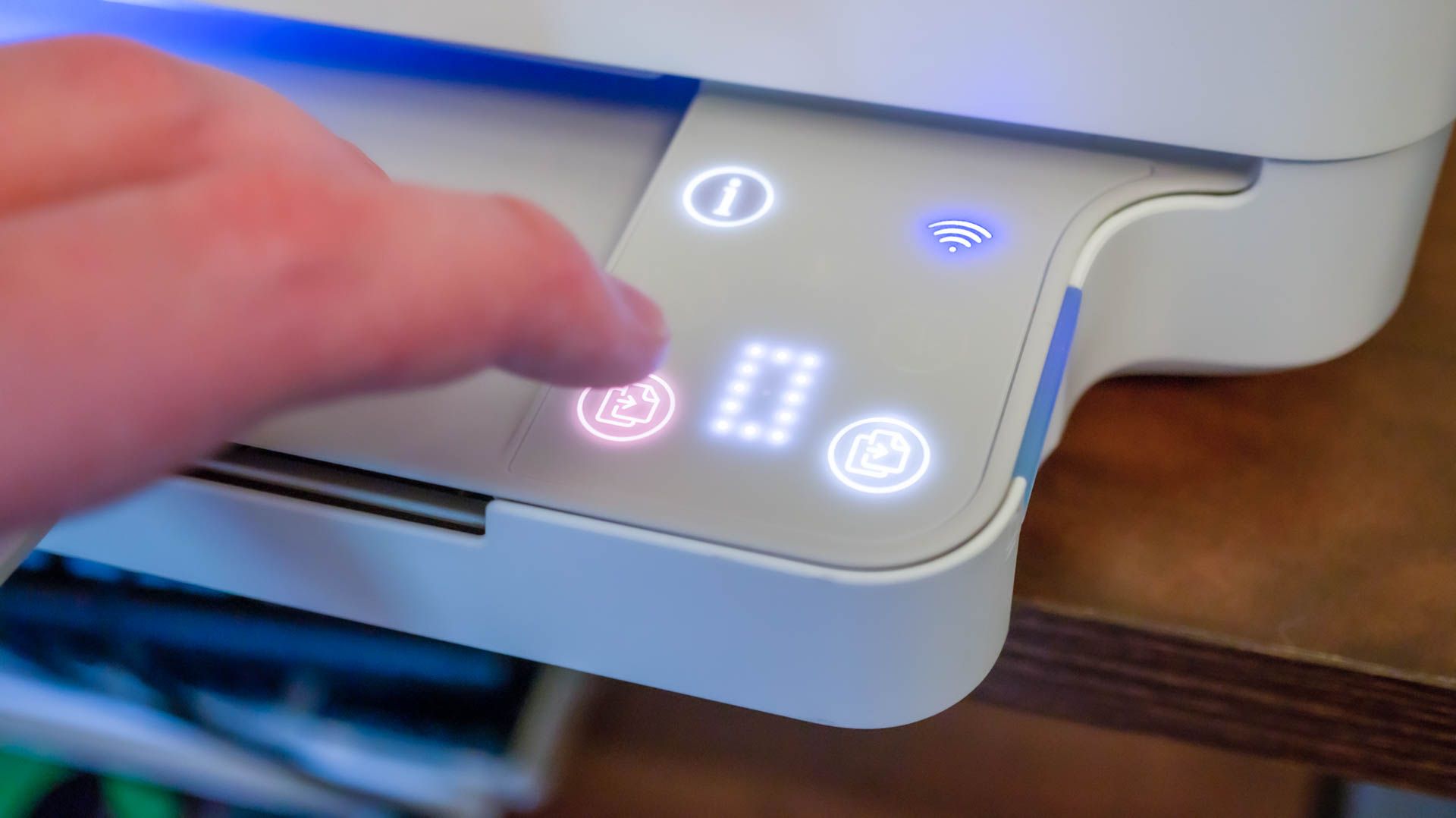 Person interacting with the HP Envy 6055e home printer