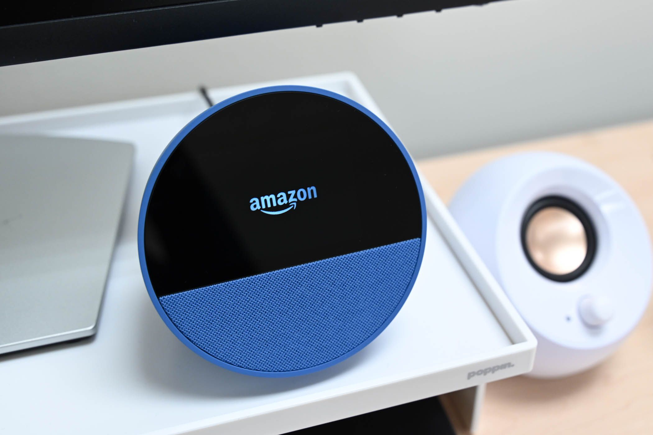 The Amazon logo on the Amazon Echo Spot