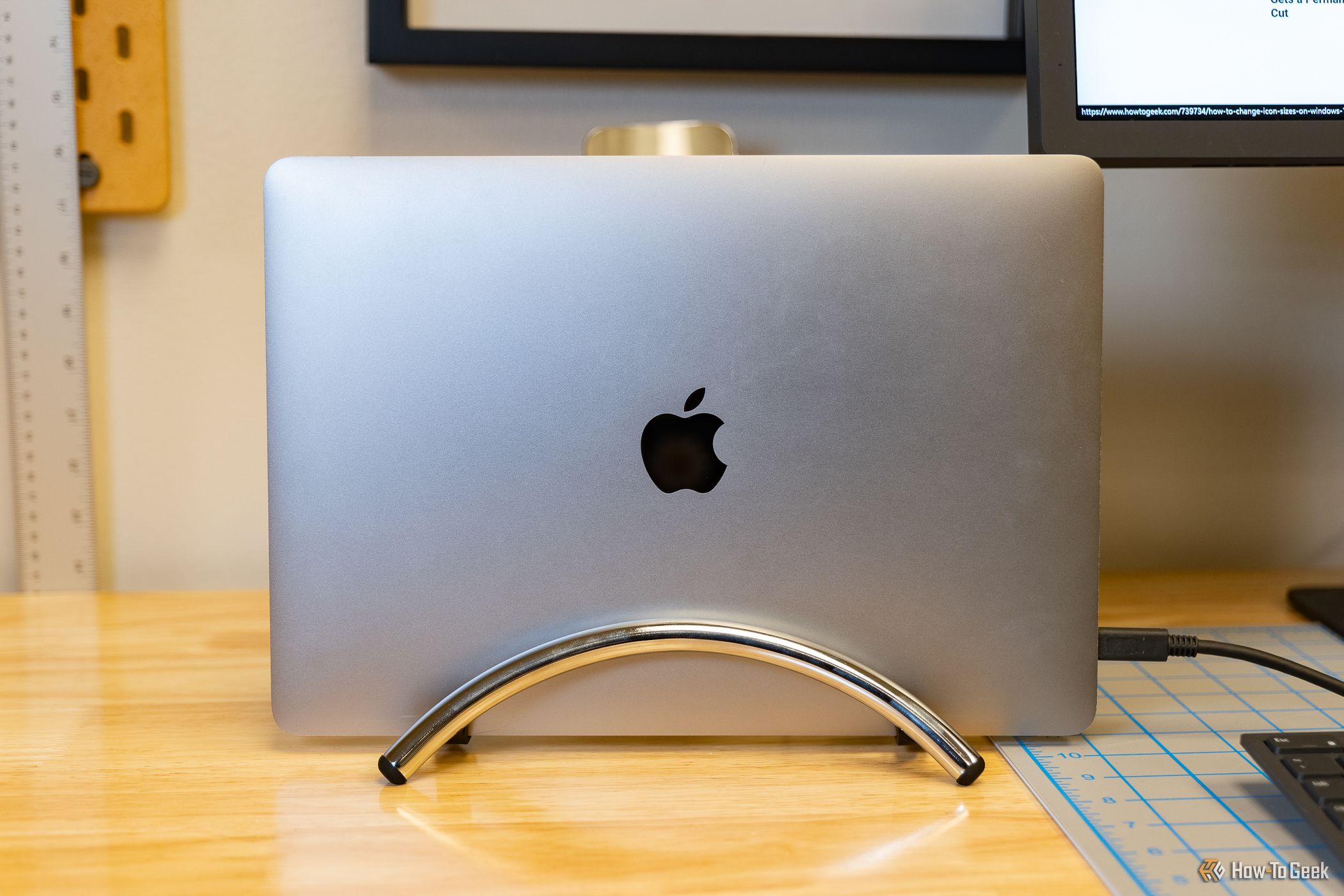 A Macbook sitting horizoltally on the Twelve South Book Arc Flex