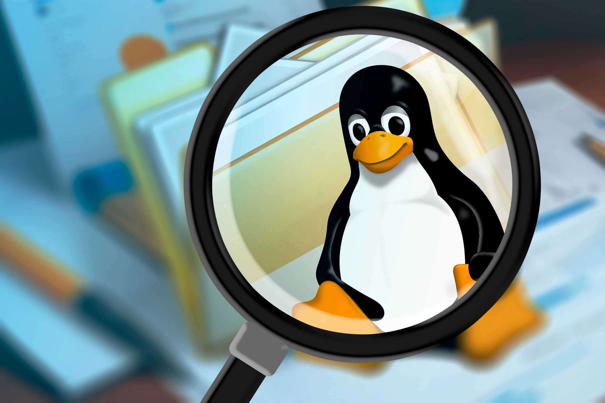 A magnifying glass pointed at the Linux mascot next to a file folder