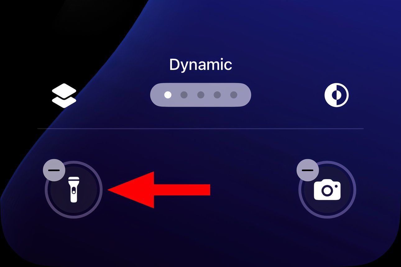 A closeup of the iPhone's Lock Screen in Edit mode with the flashlight shortcut icon annotated.