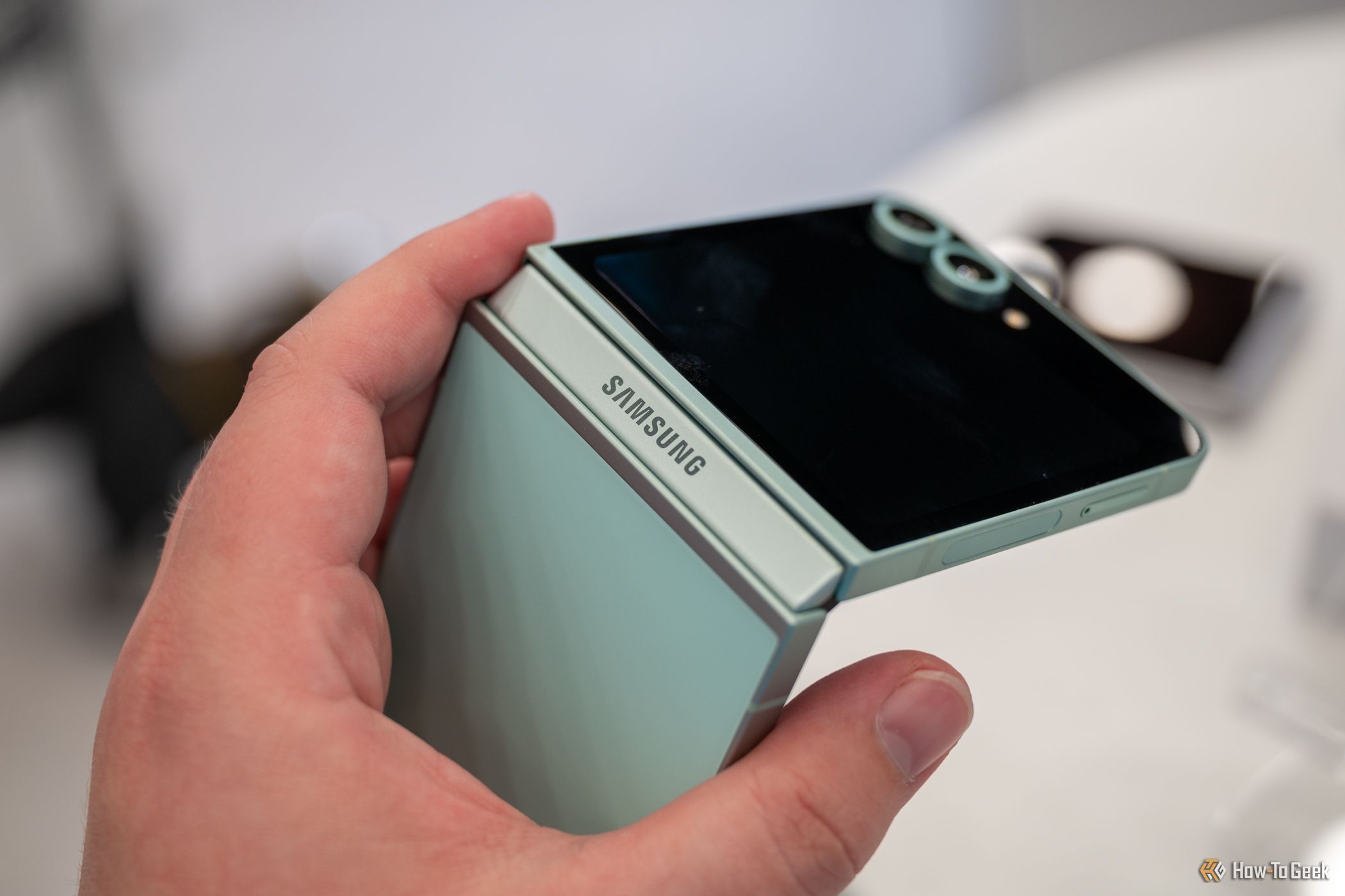 Person holding the Samsung Galaxy Z Flip 6 showing the hinge