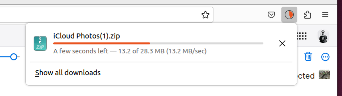 iCloud Photos downloading in a ZIP archive.