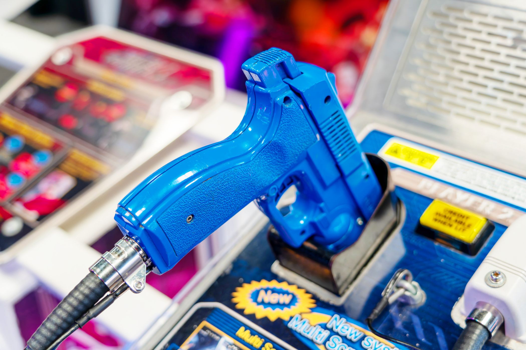 A light gun controller on an arcade game.