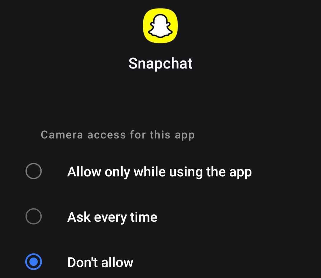 Revoking camera access of Snapchat app in Android settings.