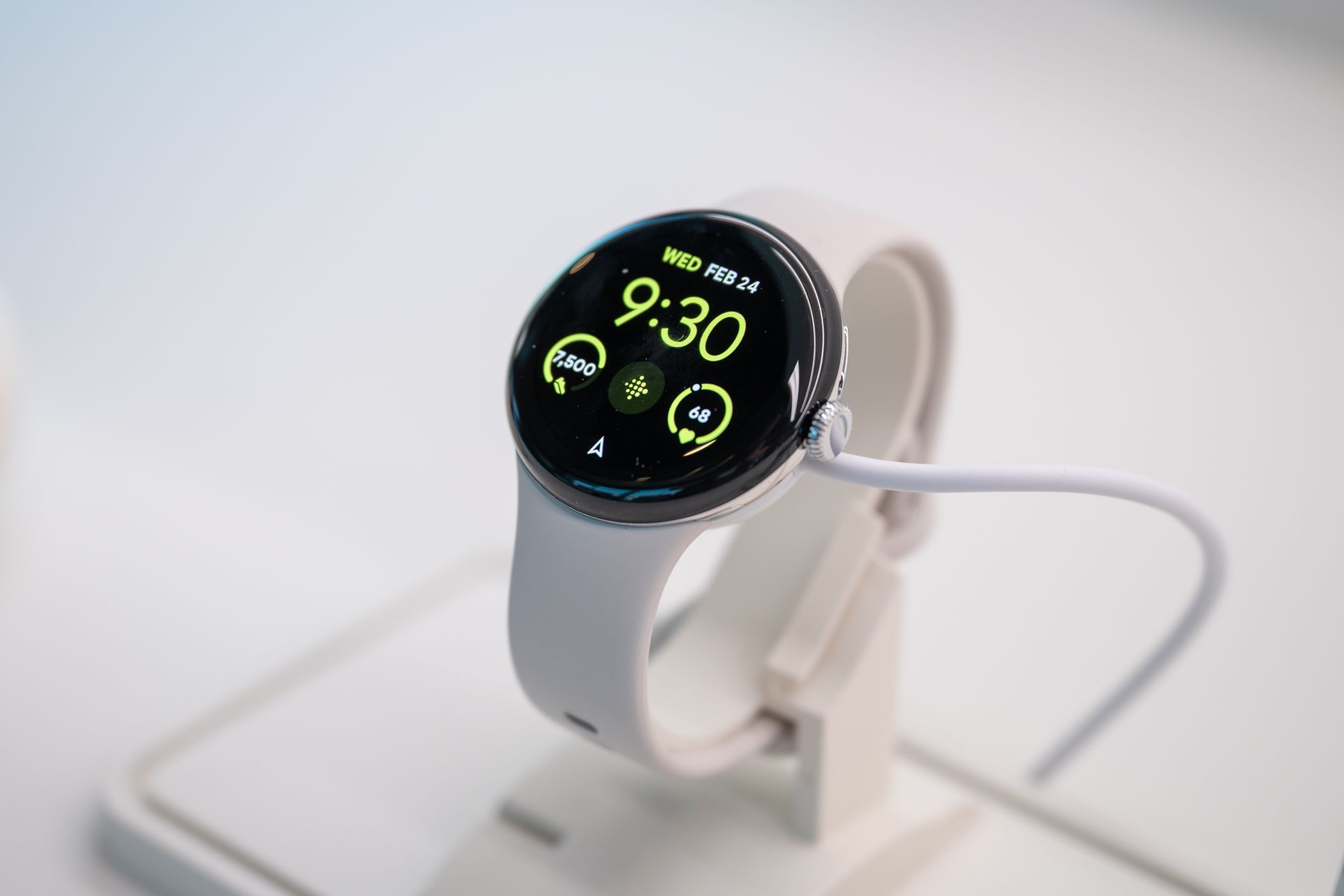 A Google Pixel Watch 2 on a stand.