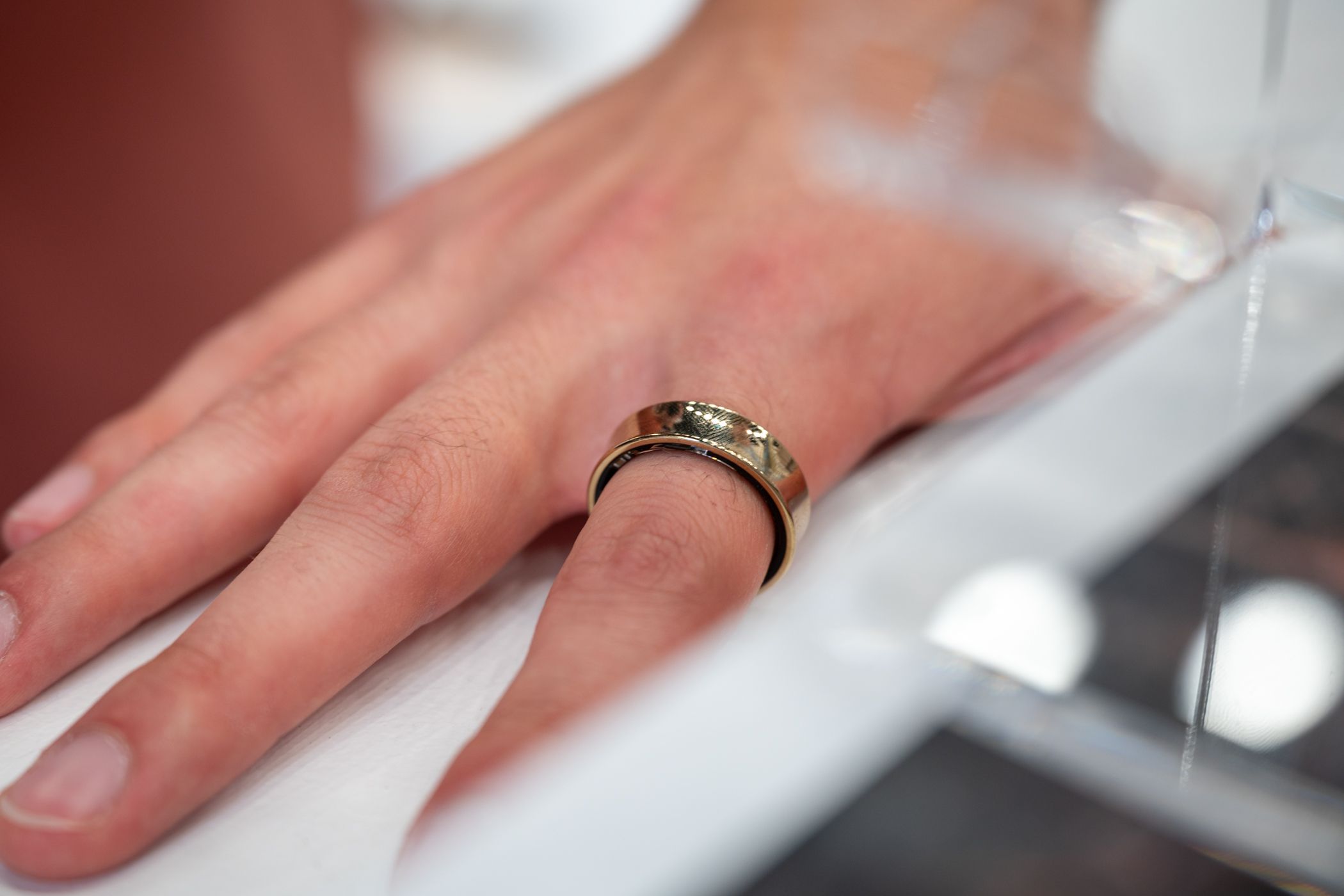 A closeup of a hand wearing the Samsung Galaxy Smart Ring.