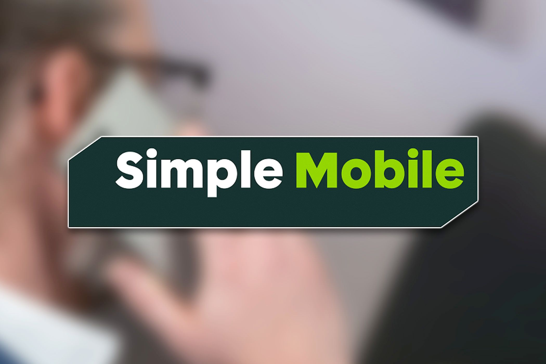 The Simple Mobile logo over a picture of someone talking on a phone.