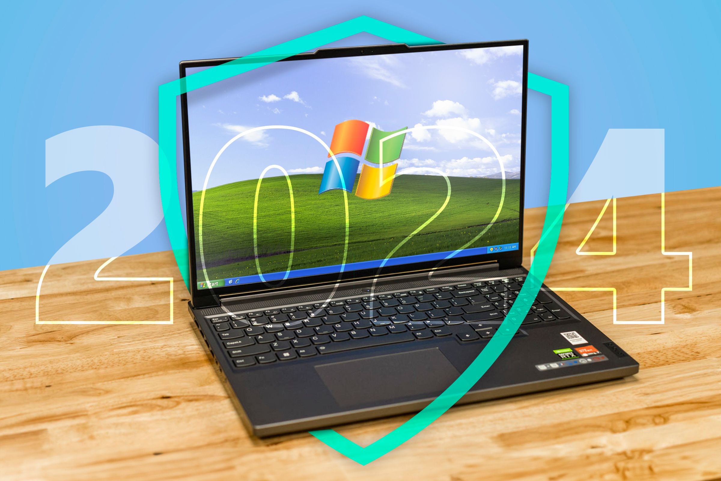 A laptop running Windows XP with a shield surrounding it.