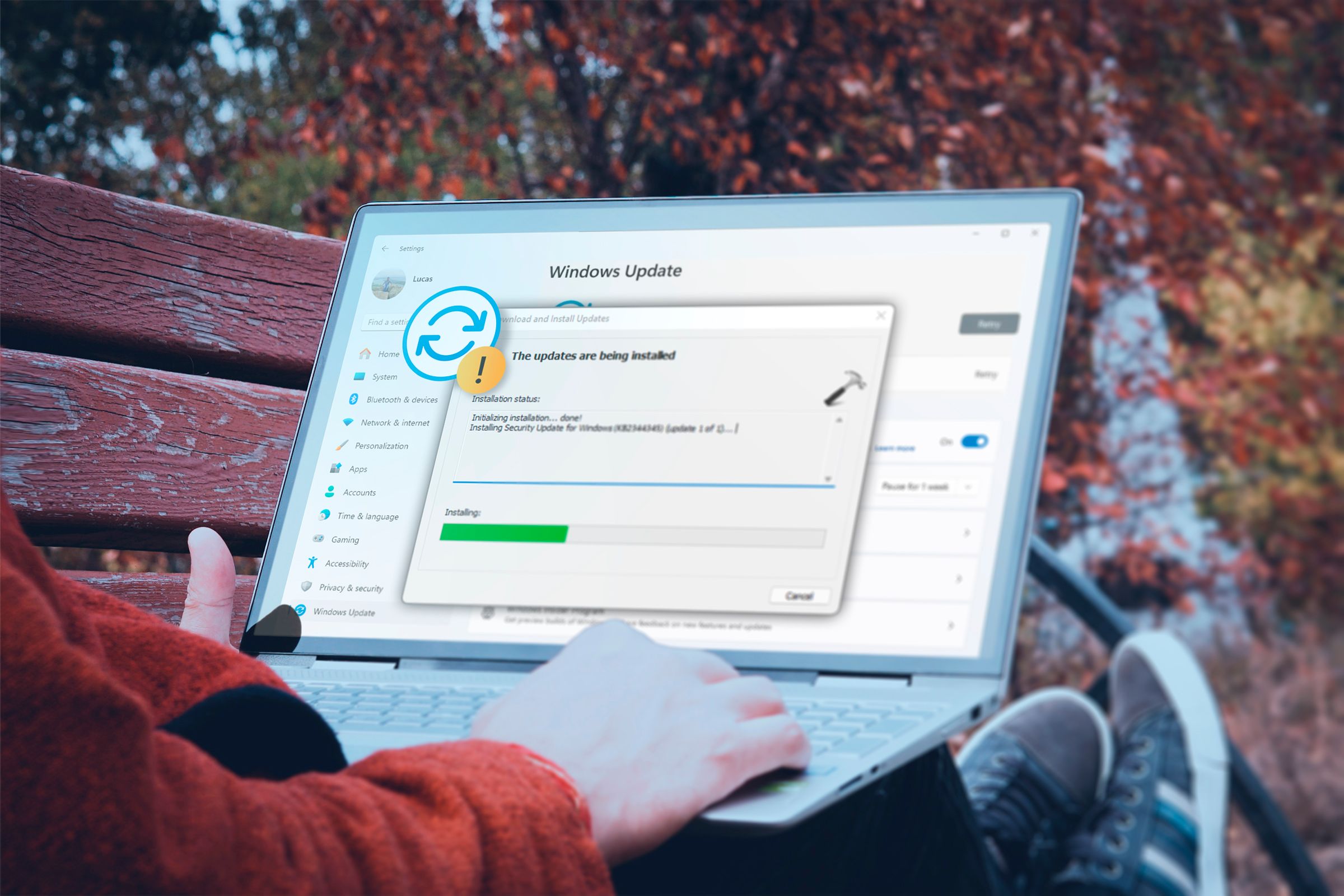 A person using a laptop with Windows 11 installing updates.