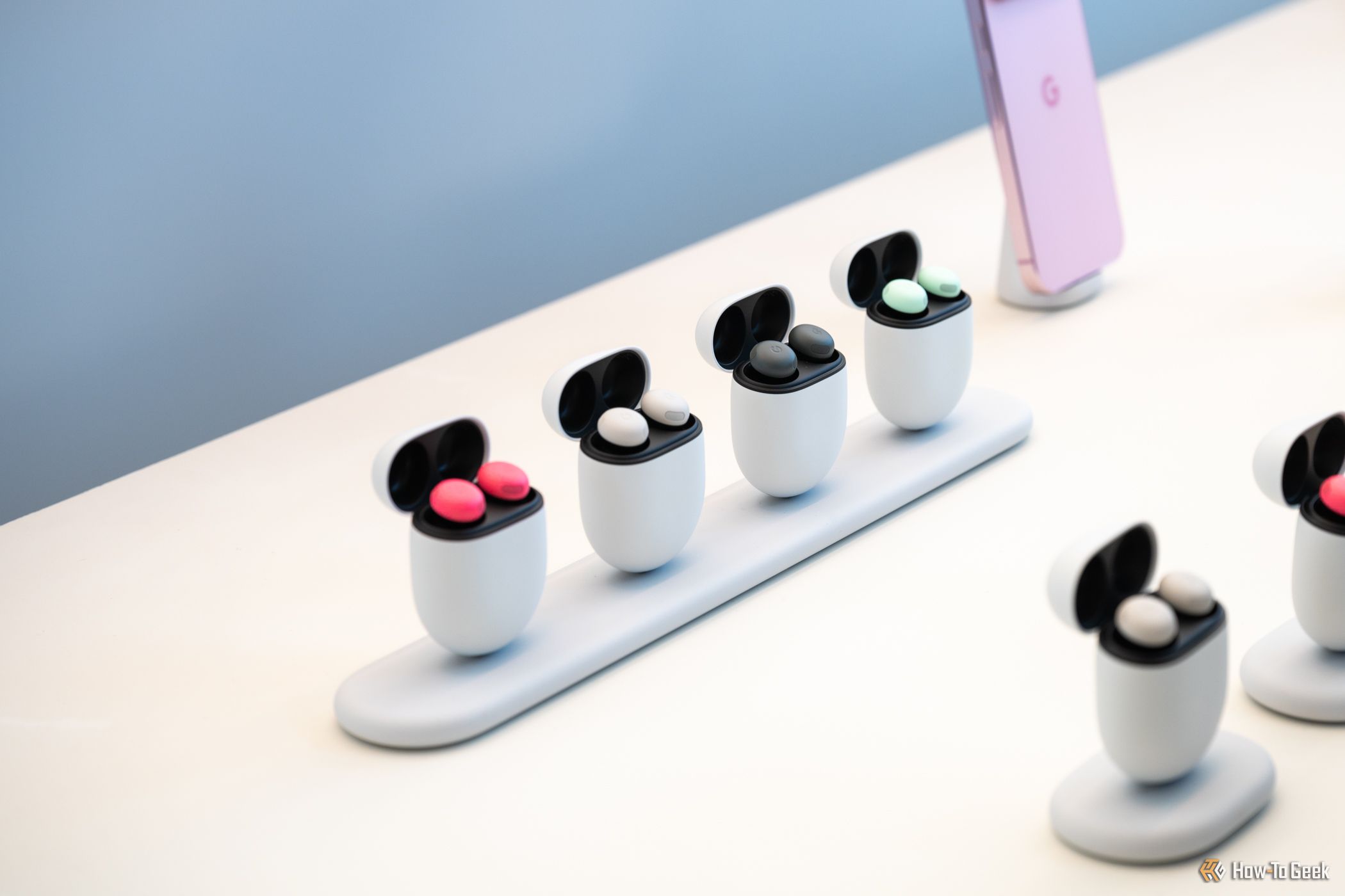 Google Pixel Buds Pro 2 in multiple colors sitting on a table