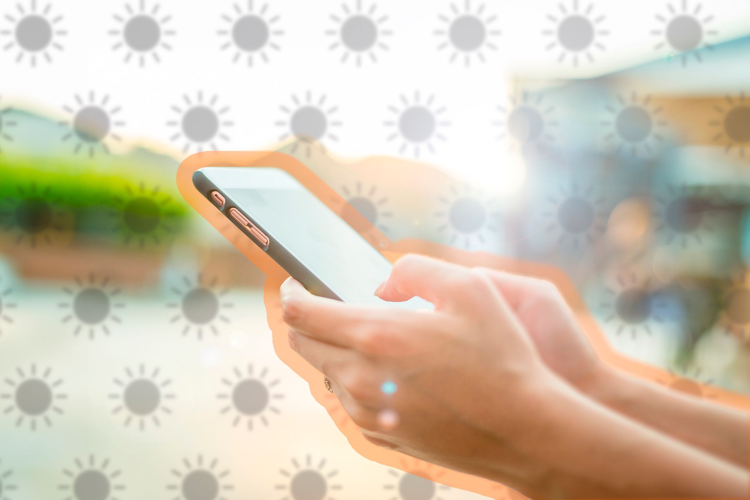 Person using a phone with a strong sunlight.