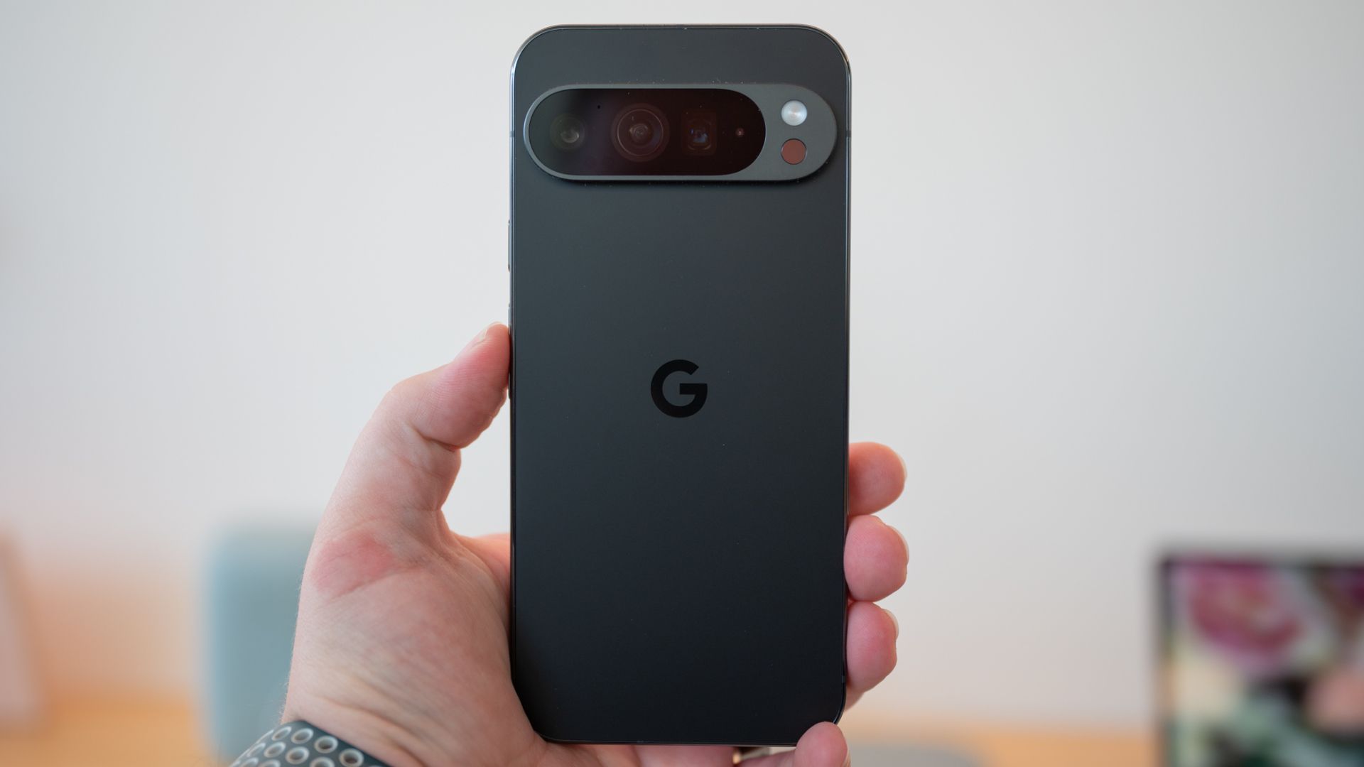 A person holding the Google Pixel 9 Pro smartphone.