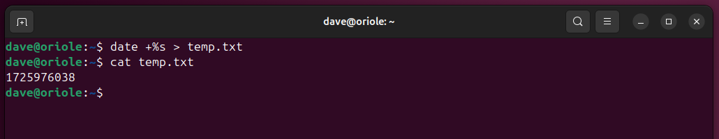 Redirecting the output from date command into a file, and using cat to see what was written to the file.