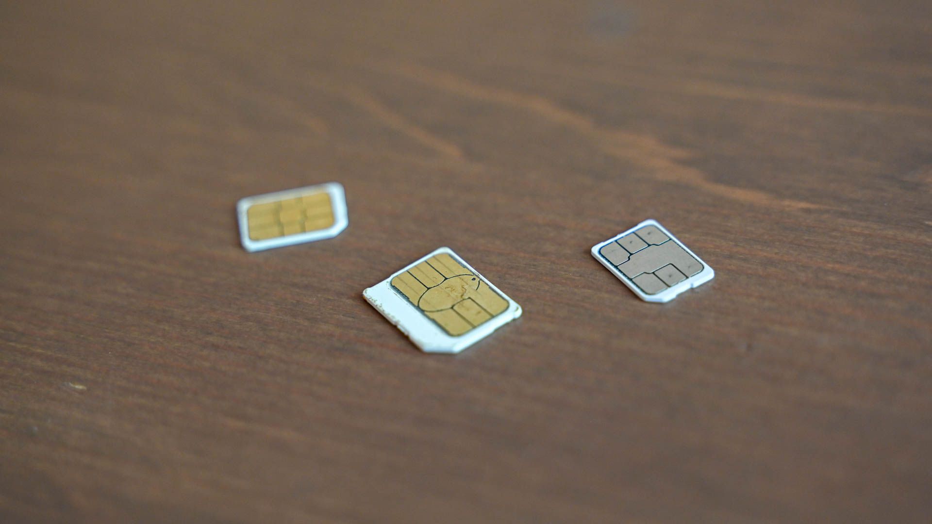 Some SIM cards on a table.