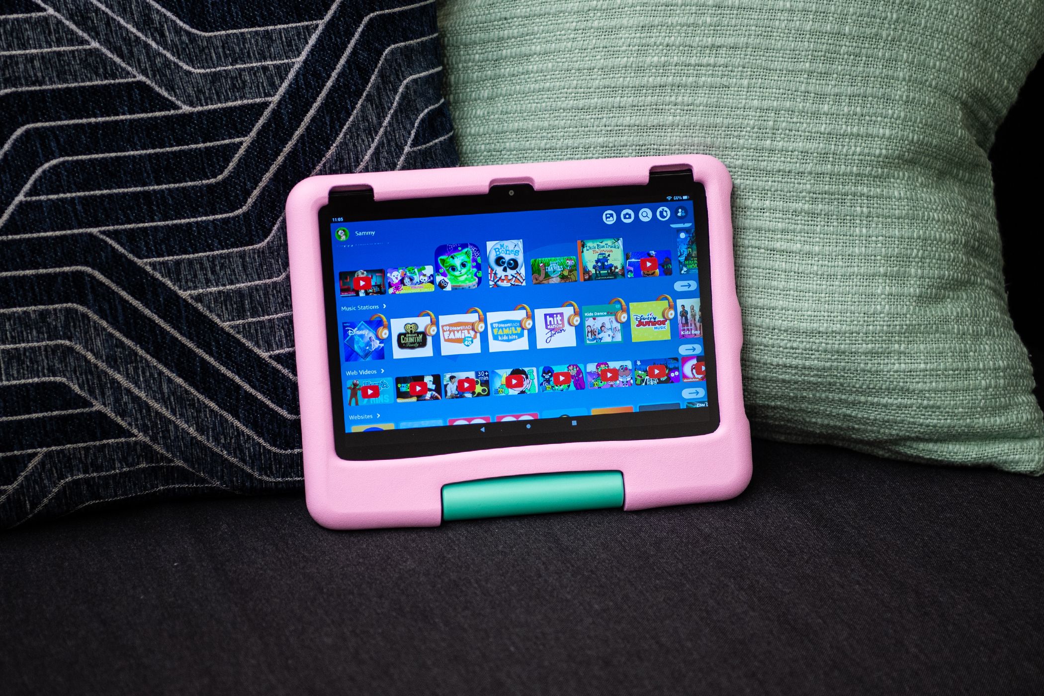 The Amazon Fire HD 10 Kids Tablet on a couch.