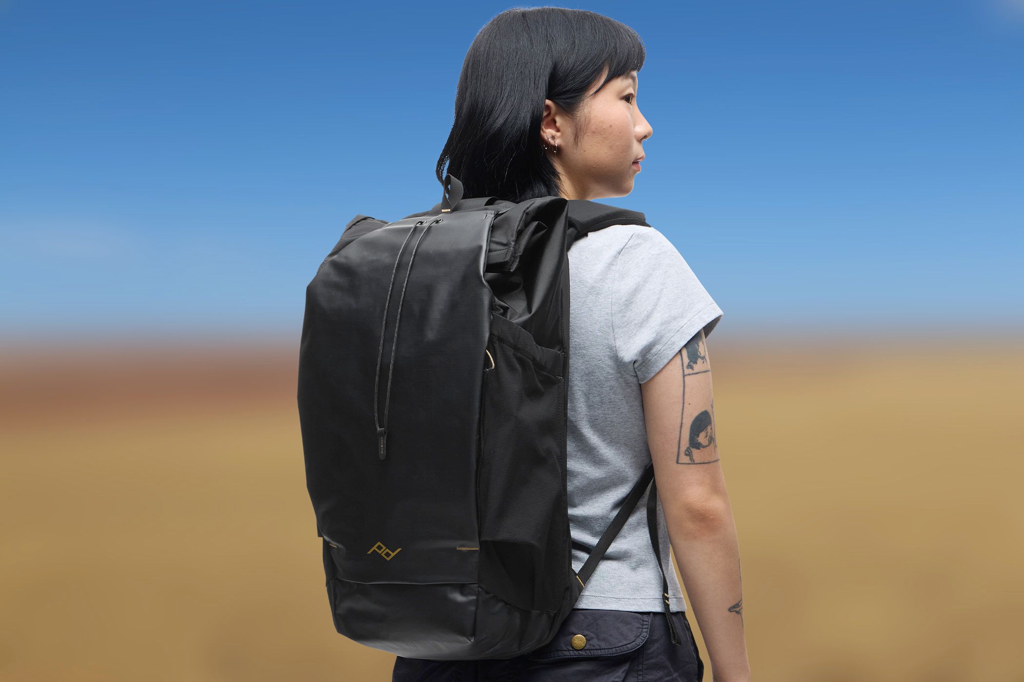 Someone wearing the Peak Design Outdoor Backpack.