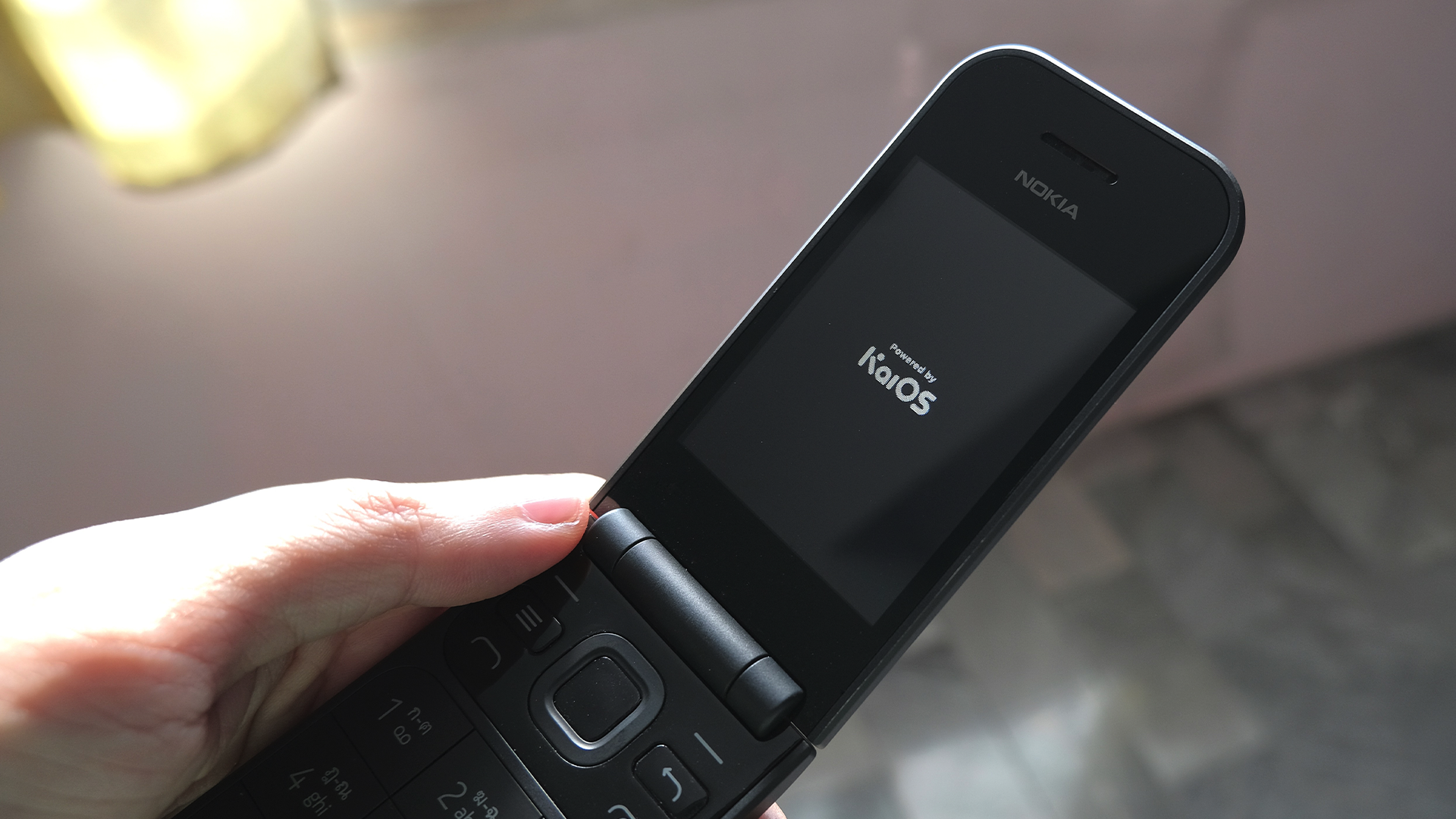 A Nokia folding flip phone running KaiOS.