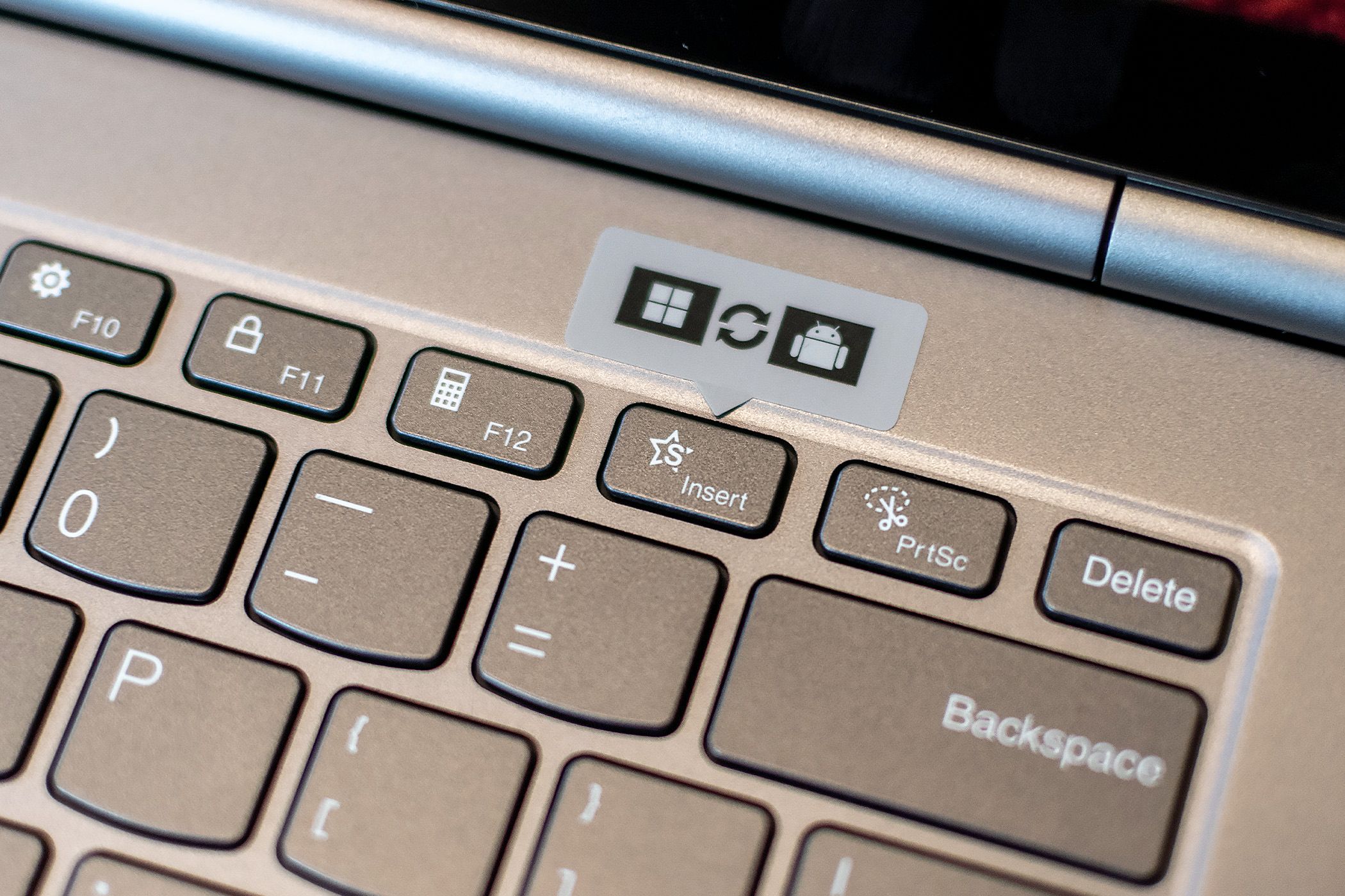 A function key on the Lenovo ThinkBook Plus Gen 5 Hybrid labeled with a Windows and Android sticker.