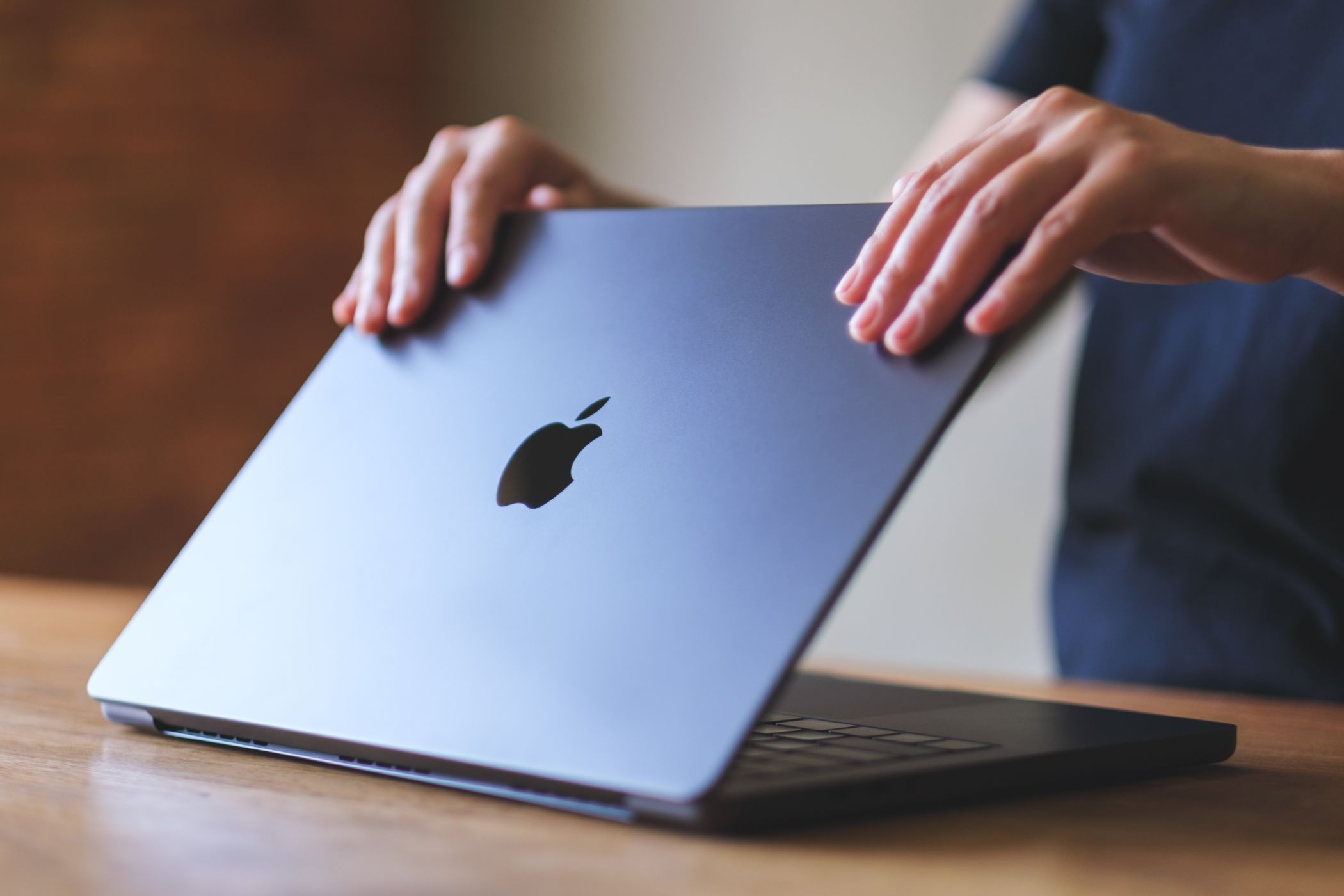 A MacBook Pro being opened.