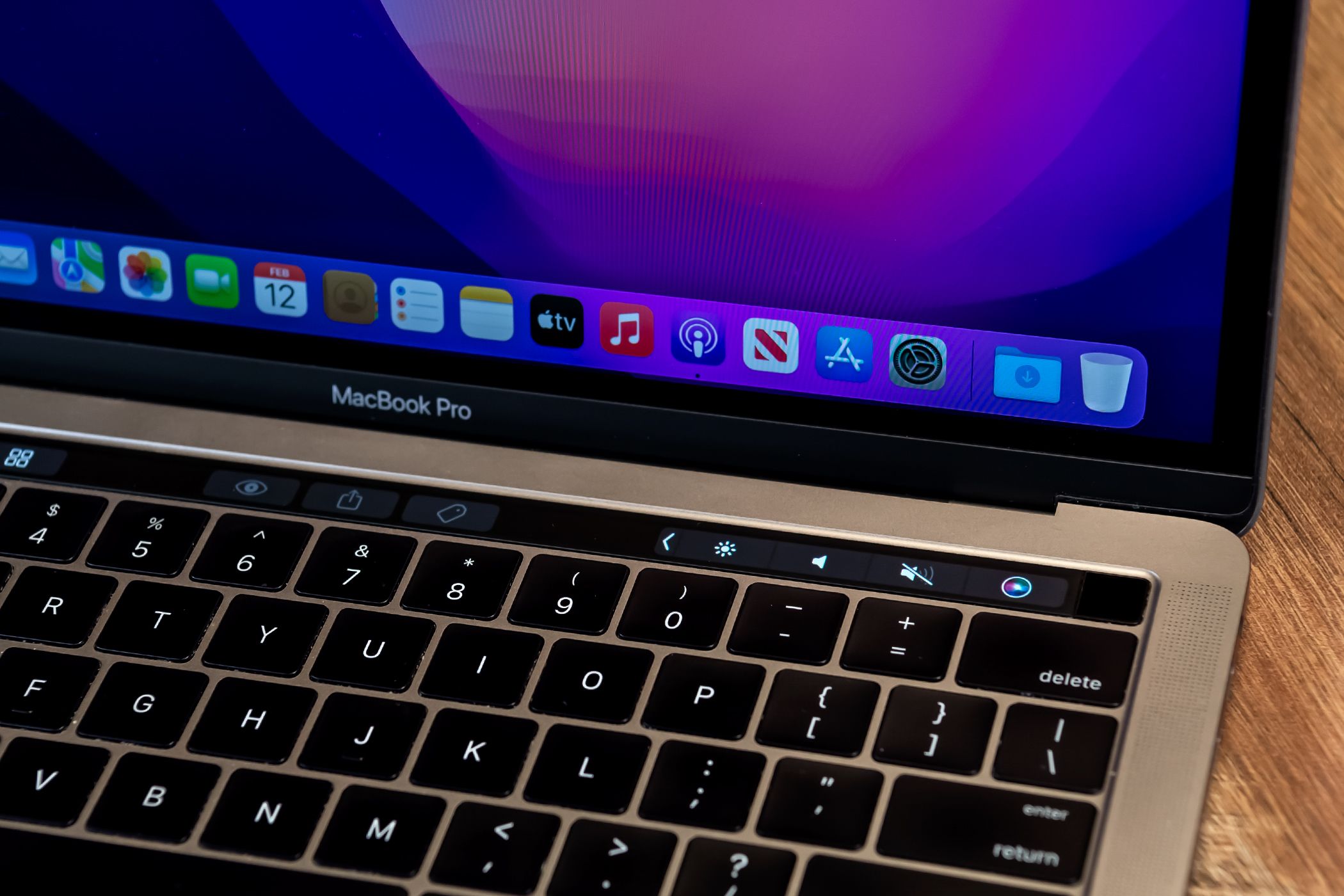 A MacBook Pro with the Touch Bar visible