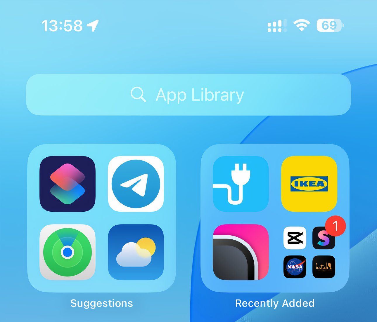 The iPhone's App Library with icon labels visible.