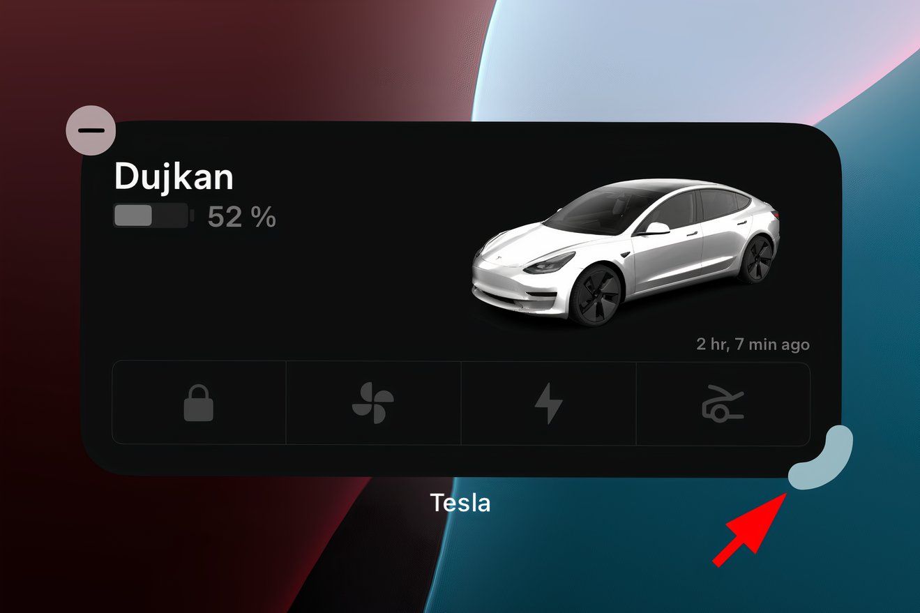 Closeup of a Tesla widget on the iPhone's Home Screen with a red arrow pointed at the drag handle in the widget's bottom-right corner.