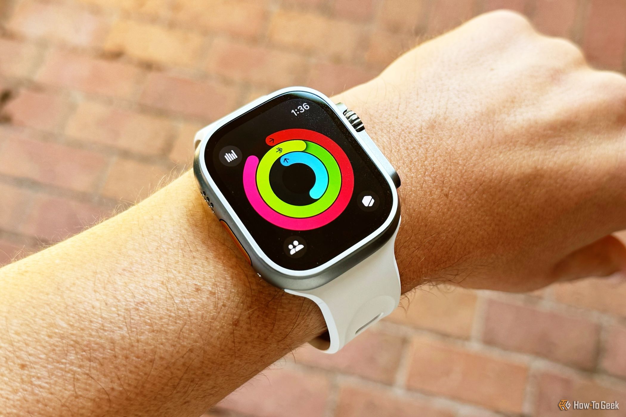 Apple Watch Ultra 2 showing activity rings almost completed.