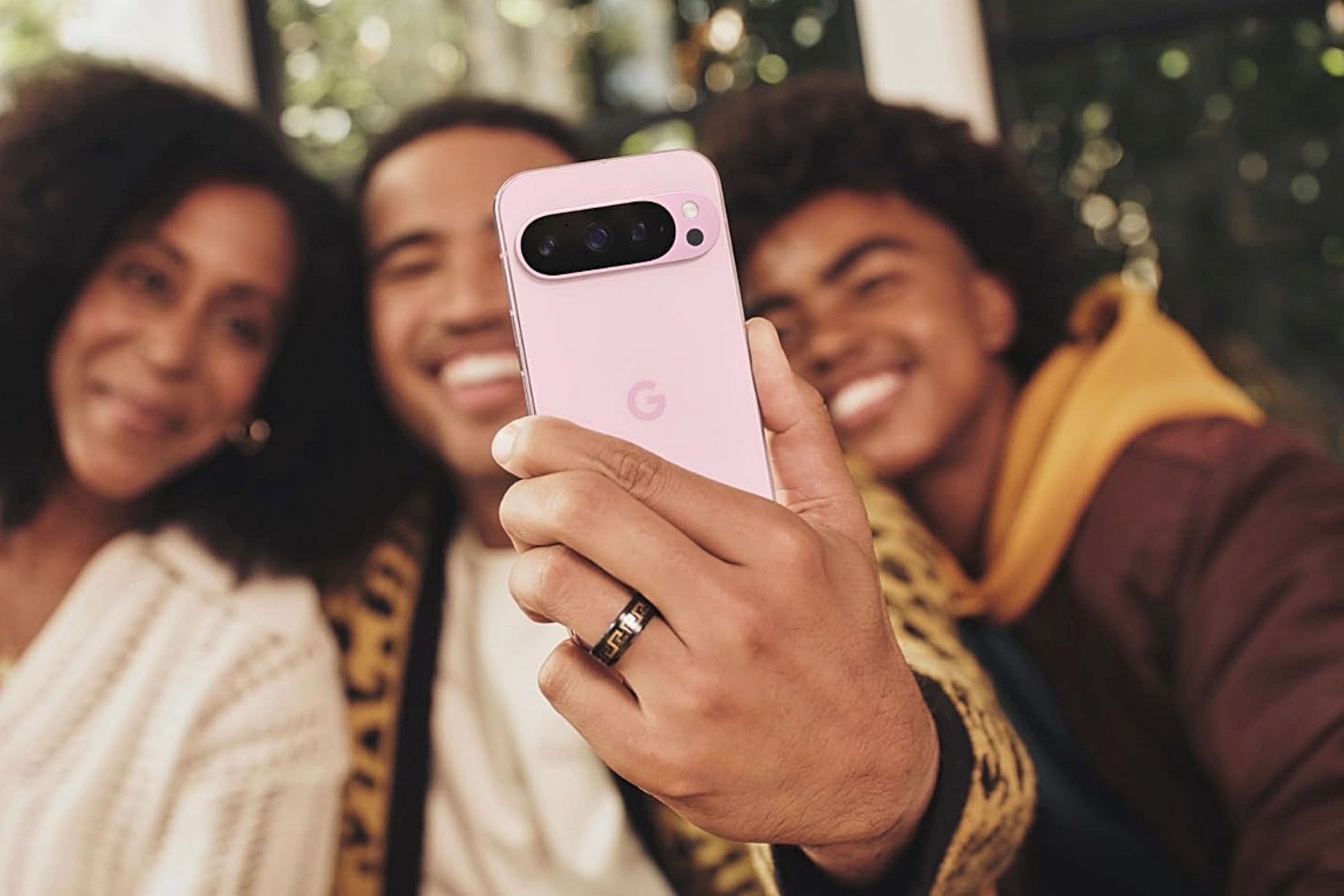 A group of people taking a selfie with the Google Pixel 9 Pro XL.