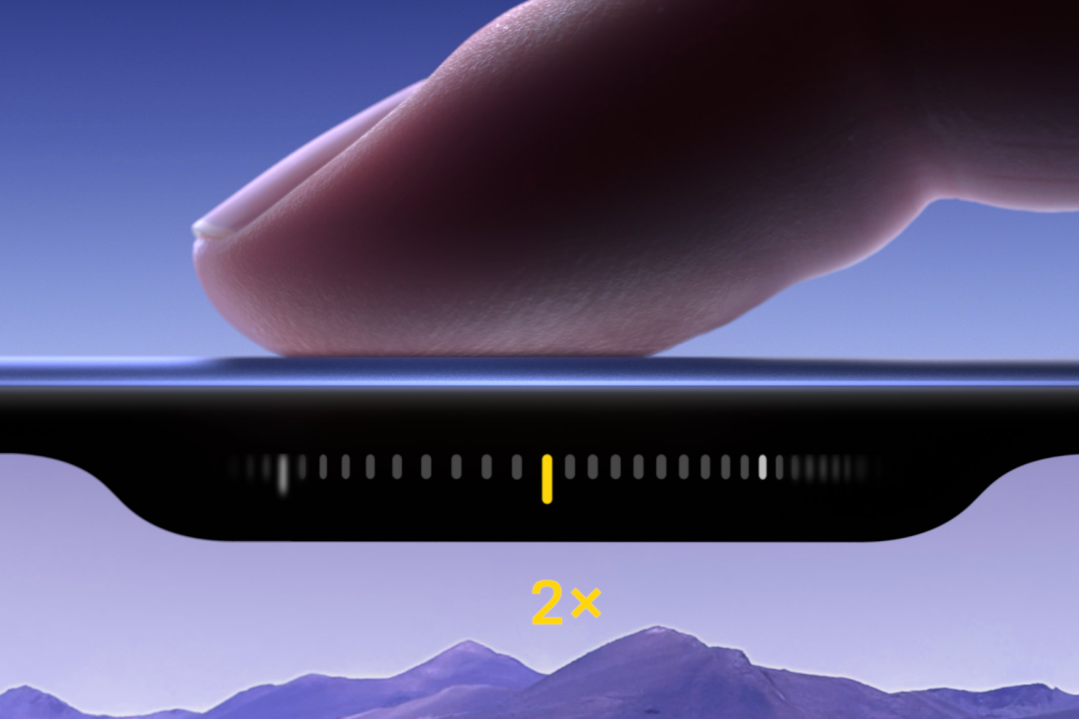 Finger on iPhone 16 Camera Control button.