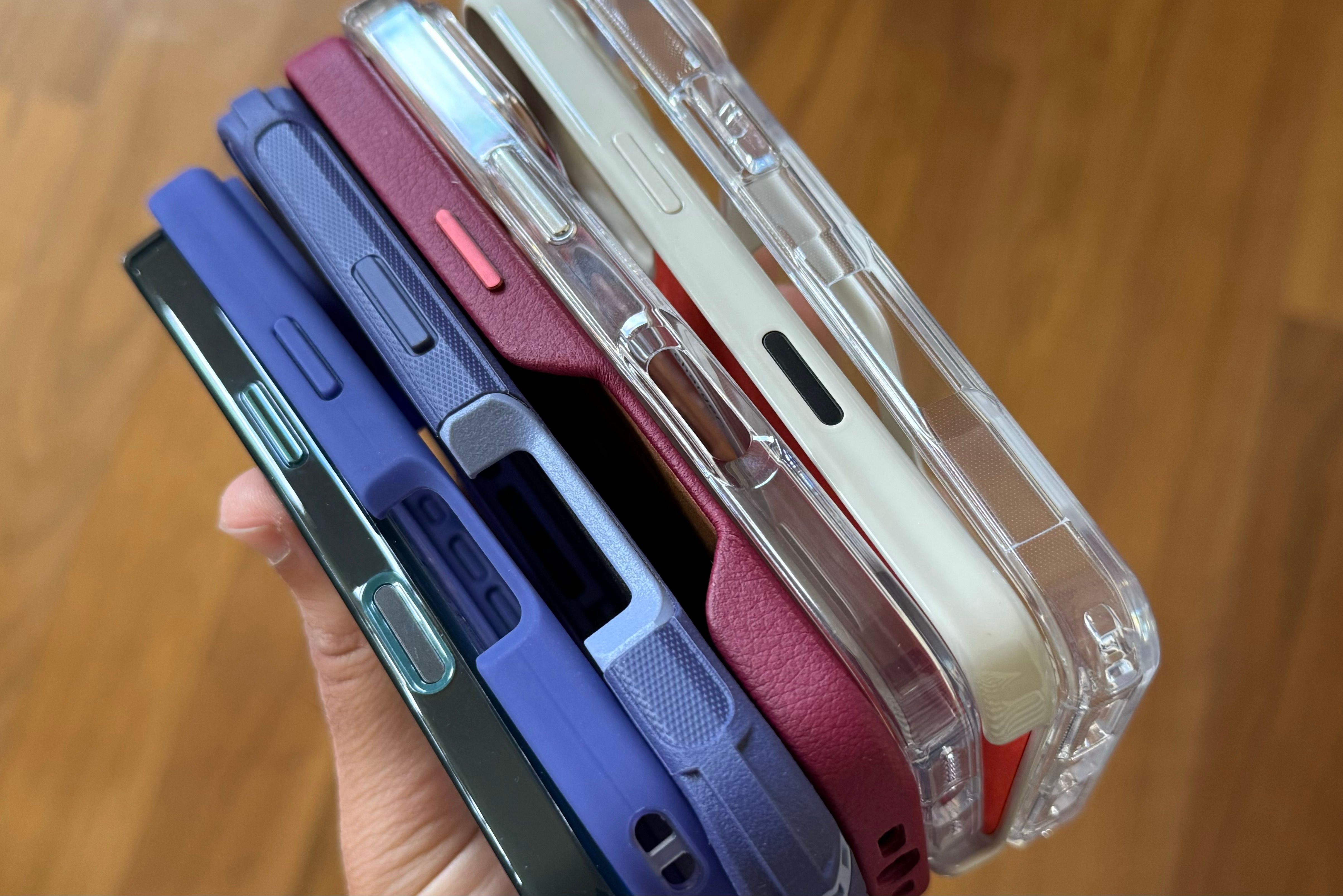 Someone holding a stack of iPhone 16 Pro cases