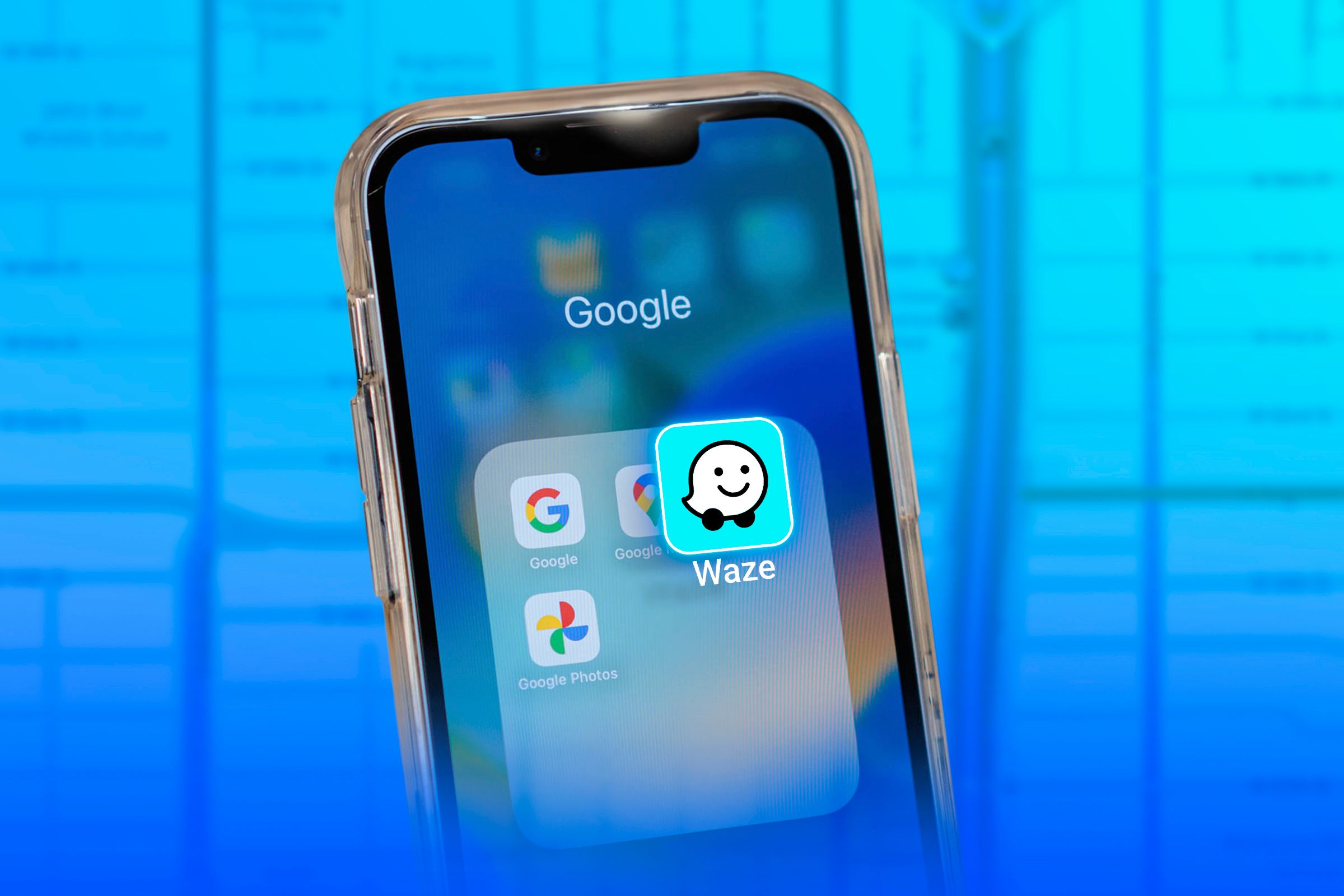 A phone with the Waze icon overlapping the Google Maps icon.