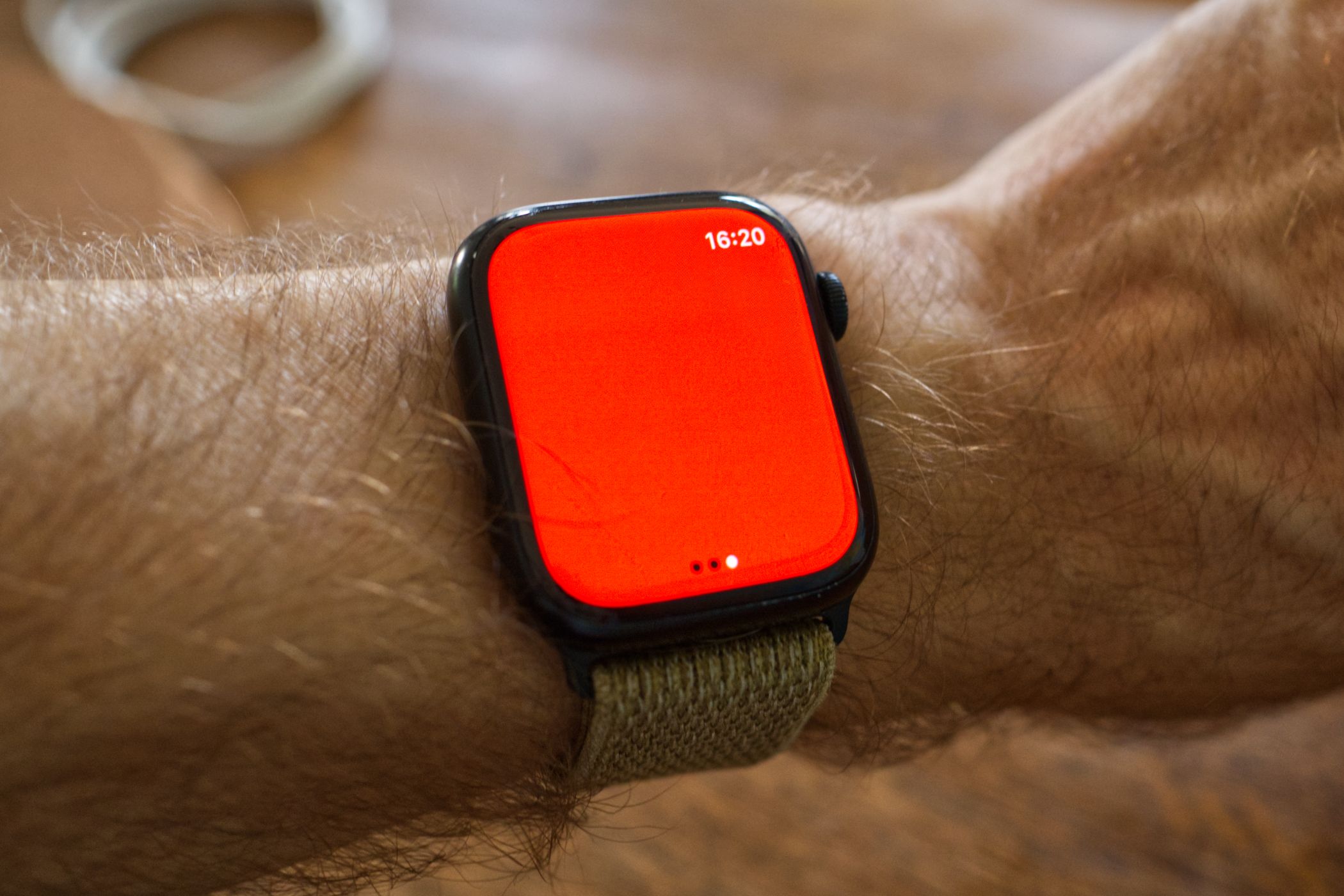 Apple Watch Series 8 with a red flashlight mode enabled.