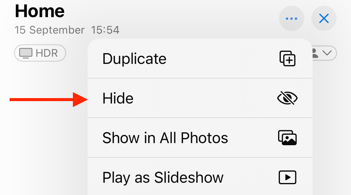 Hiding a photo or video using the Photos app.