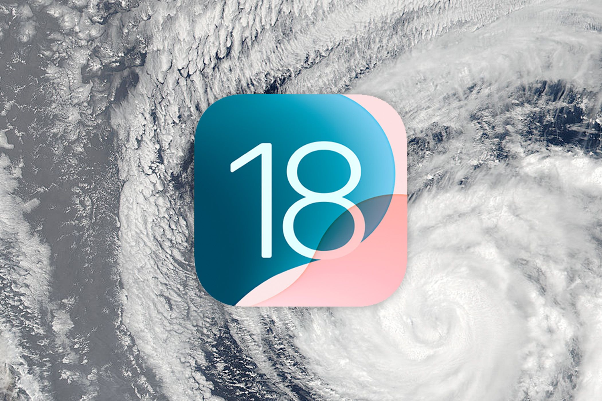 iOS 18 logo with a photo of a hurricane from Earth orbit.