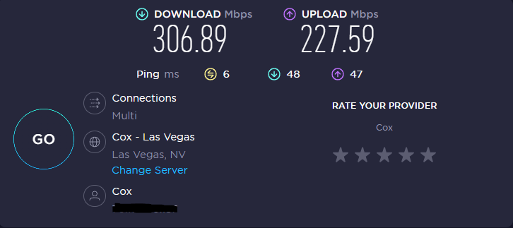 A Lenovo network speed test showing 306 download speed and 227 upload speed