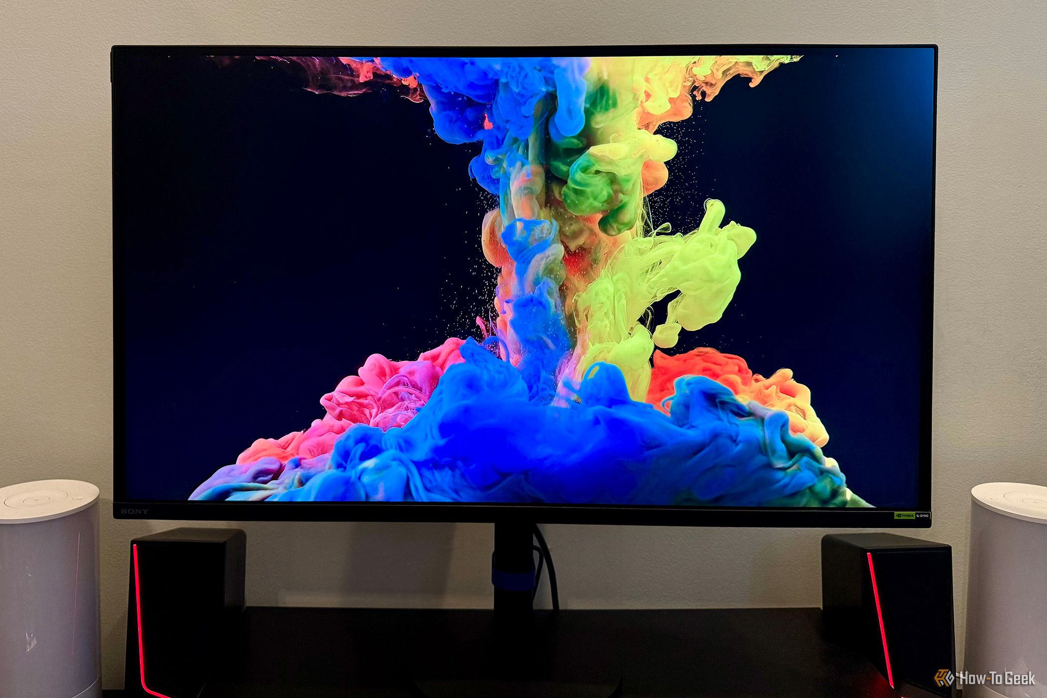 Sony Inzone M9 II Monitor on a desktop displaying colorful splashes.