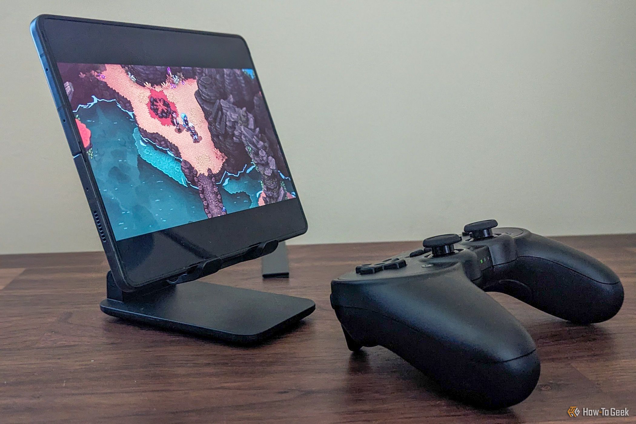 Playing a game in a phone resting on a stand with a Bluetooth controller.