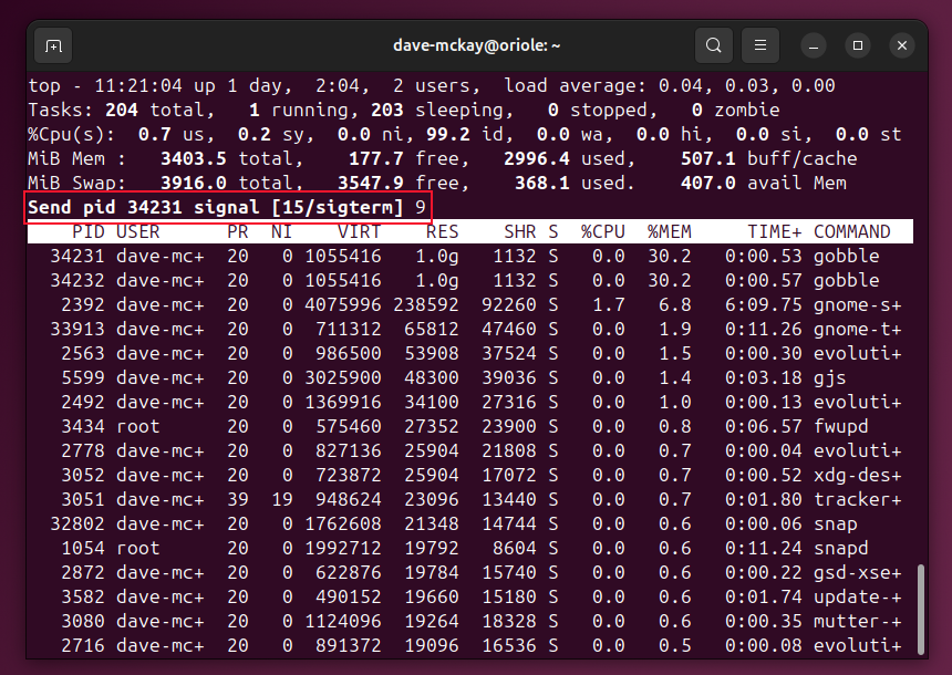 The top program accepting a signal number to send to the chosen process. The user has entered the digit 9.